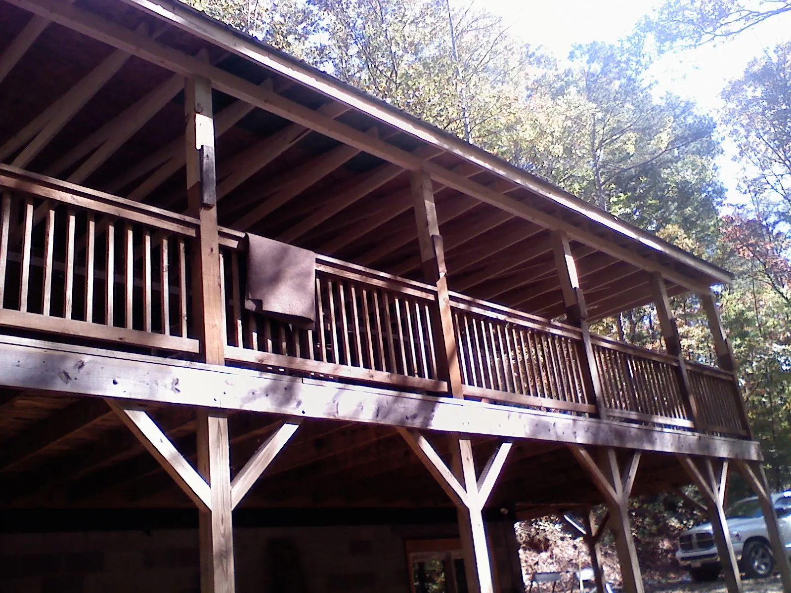 Timber framing under a new elevated porch and deck — Roof Leak Repair in Grand River by Roofing Brothers